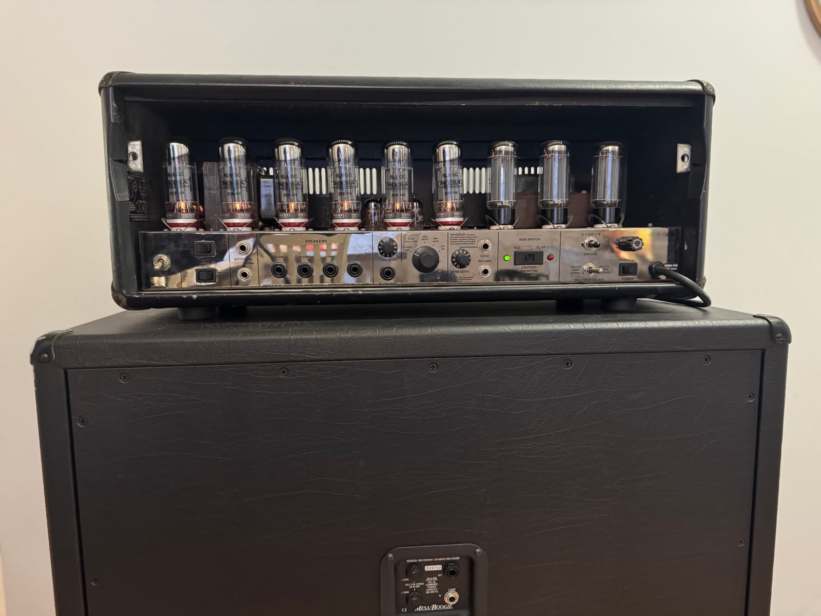 Back panel of the Mesa/Boogie Triple Rectifier — the full tube array above the chrome rear panel with its FX loop Send/Return and speaker outputs